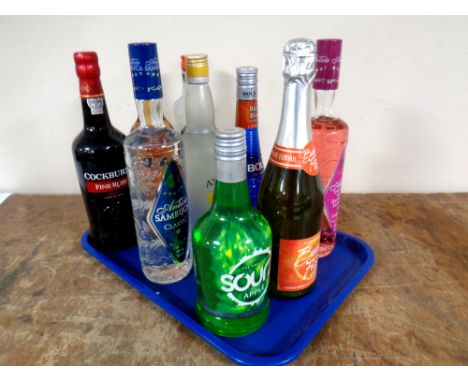 A tray containing nine bottles of alcohol to include Cockburn's Port (75cl), Taboo Infused Vodka (70cl), Archer's Schnapps (7