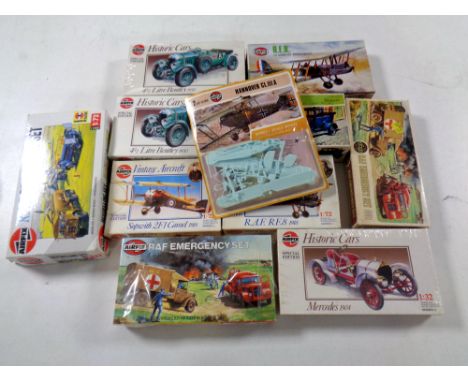A tray containing 12 assorted vintage Airfix kits to include model aircraft, historic cars, RAF Emergency set   