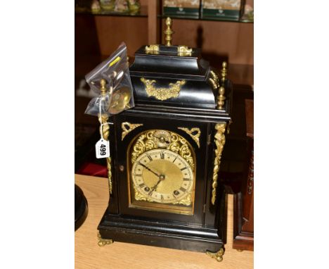 A LATE 19TH CENTURY EBONISED AND GILT METAL BRACKET CLOCK OF GEORGE III STYLE, brass dial marked Spiridion & Son, Cardiff, th