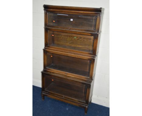 AN OAK FOUR SECTIONAL BOOKCASE, the Globe-Wernicke Co Limited, London, with glazed flap front sections, width 87cm x depth 36