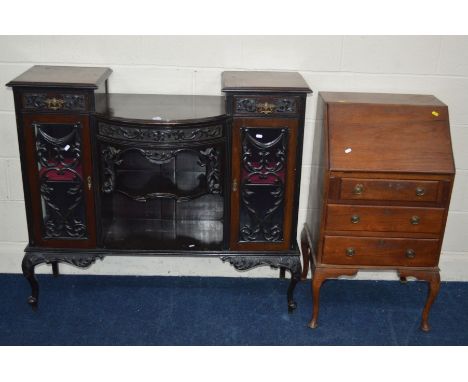 AN EDWARDIAN MAHOGANY FOLIATE DECORATED SIDE UNIT with two short drawers above glazed cupboard doors flanking an open shelf, 