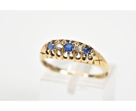 AN EARLY 20TH CENTURY 18CT GOLD SAPPHIRE AND DIAMOND RING, designed as a graduated line of three circular sapphires interspac