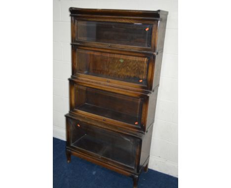 AN OAK FOUR SECTIONAL BOOKCASE, the Globe-Wernicke Co Limited, London, with glazed flap front sections, width 87cm x depth 36