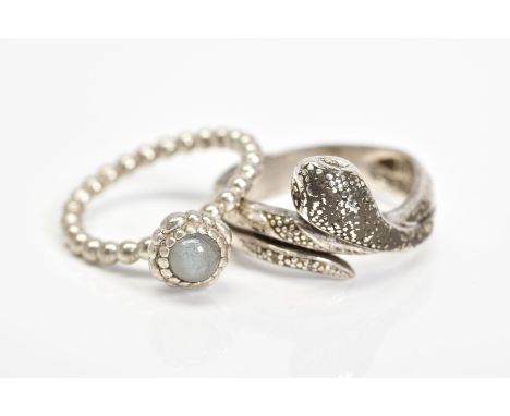 A PANDORA RING AND A SNAKE RING, the Pandora ring designed with a circular rock crystal cabochon within a beaded surround to 