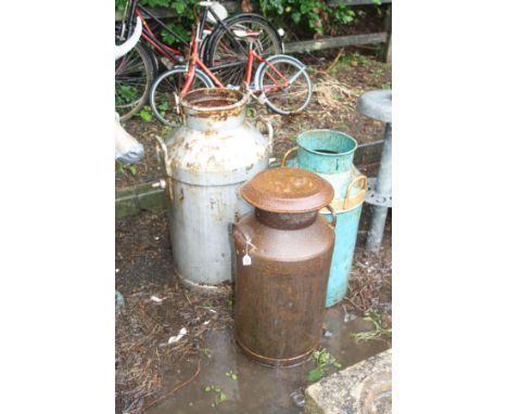TWO COW AND GATE STEEL MILK CHURNS AND A STEEL BUTTER CHURN, one milk churn has a lid and the other has not, height 70cm and 