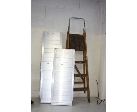TWO ALUMINIUM FOLDING RAMPS, one 122cm long, the other 92cm long and a pair of vintage step ladders