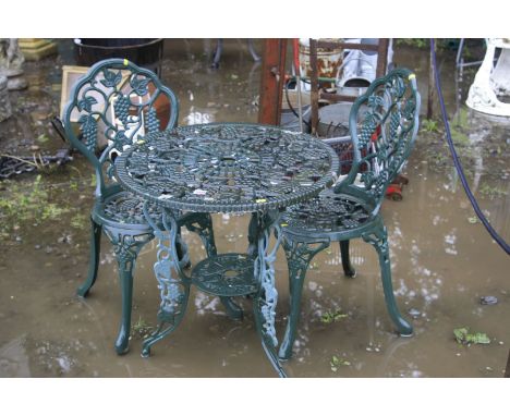 A GREEN CAST ALUMINIUM CIRCULAR GARDEN TABLE, diameter 65cm a pair of matching chairs (sd) and a set of aluminium step ladder