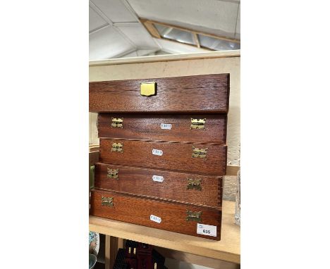 Five collectors boxes together with a decanter and a paraffin lamp