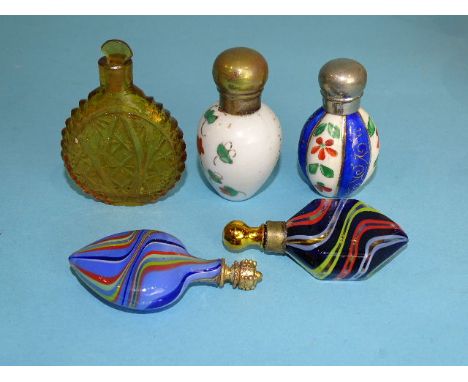 Two metal-mounted ceramic scent bottles, 54mm and 58mm high and three small glass scent bottles, (5). 