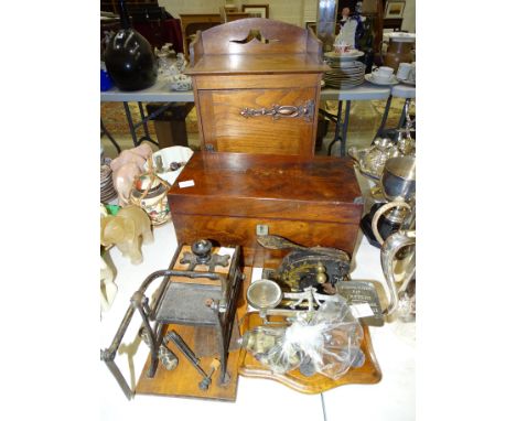 An early 20th century oak smoker's cabinet, 28cm wide, 39.5cm high, 20cm deep; a walnut rectangular tea caddy with two cannis