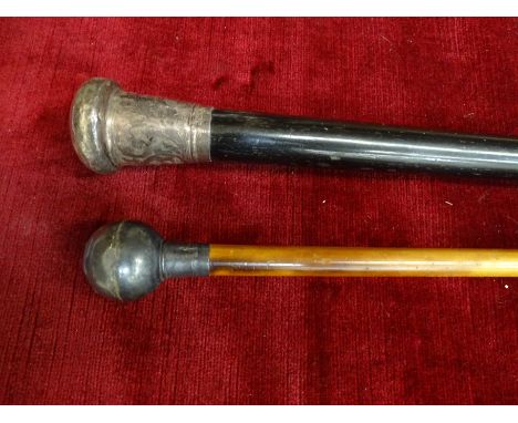 A military swagger stick with silver pommel for The Prince of Wales Own XIV Regiment, 71cm long, together with a silver toppe