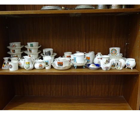 A collection of approximately fifty pieces of W H Goss crested ware including cups and saucers, vases, jug, together with sev