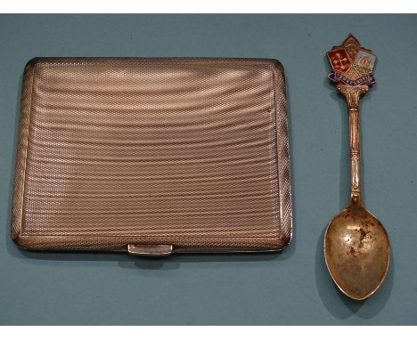 A silver engine-turned cigarette case, 10.5 x 8.5cm, Birmingham 1954 and a silver souvenir spoon, 4oz. 