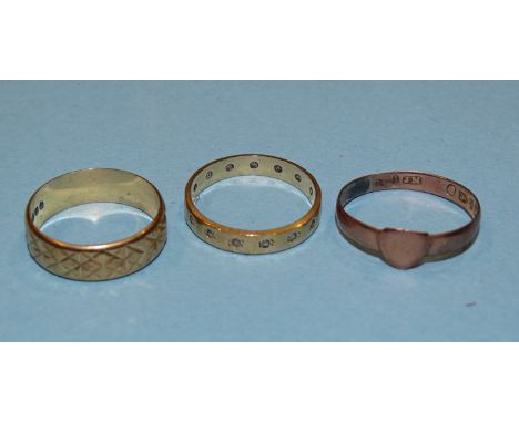 Two 9ct gold wedding bands, one set synthetic white stones, size K½ and a Victorian rose gold signet ring, size M, 1.1g, (3).