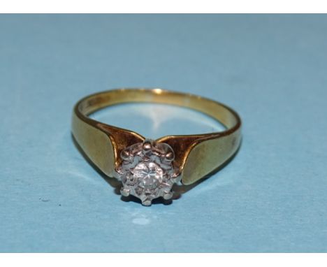An 18ct gold solitaire diamond ring illusion set a brilliant cut diamond of 0.10cts, M, 3.1g. 