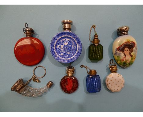 A collection of eight silver and metal-mounted glass and ceramic scent bottles,&nbsp;(8). 
