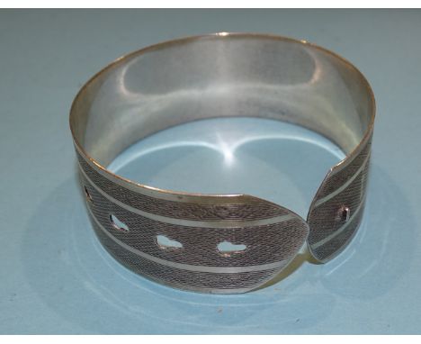 An engine turned silver bracelet by Charles Horner, Chester, 1944, adjustable size, 25mm width. 