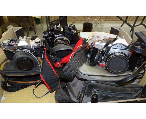 Two Canon AE1 cameras, a Praktica MTL3 camera, two other cameras, various lenses, etc. 