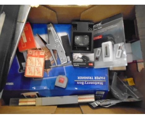 2 boxes of miscellaneous items to include Elvis booklets and mug, stationary- stapler and staples, paper trimmer, led head to