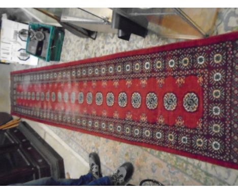 Bamboo ladder and red patterned runner 12ft long worn in places