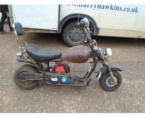 Childs chopper style bike with little engine, haven't had it running, body needs attention