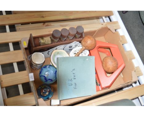 A box containing a spice rack and contents, a large hole, paperweights etc. punch;