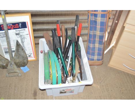 A box of various hand tools