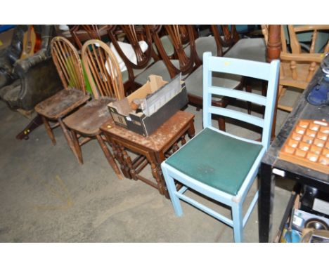 A nest of three occasional tables; and a pair of elm seated stick back chairs; and a blue painted ladder back chair 