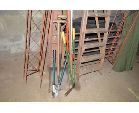 A quantity of long handled gardening tools etc