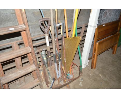 A quantity of long handled gardening tools; fire spark guard etc