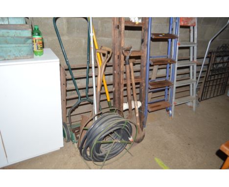 A push cylinder lawn mower; two spades; hose and reel and an extending wooden ladder 