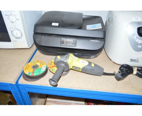 A Ryobi angle grinder with spare discs