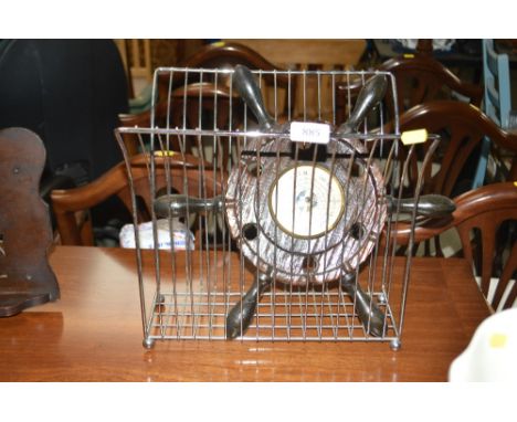 A barometer in the form of a ships wheel