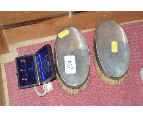 Two silver mounted brushes; cased set of 9ct gold studs and two stick pins