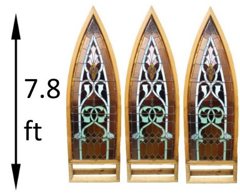 Three beautiful leaded windows having pointed arch form, scrolling motifs, some slag glass, textured panels, raised cabochons