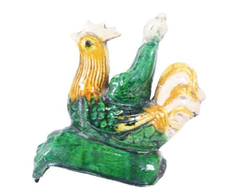 Chinese Glazed Figural Roof Tile. This piece depicts a woman riding a large rooster. This piece is in overall great condition