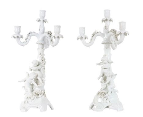 Pair of German Dresden white porcelain candelabras with four candlesticks in the form of a tree trunk hung with floral garlan