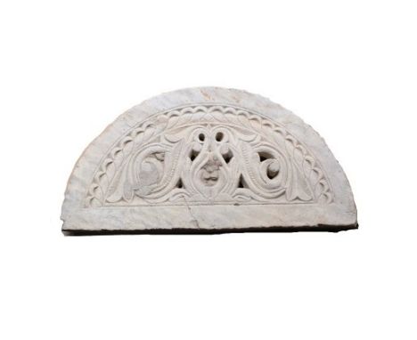 18th Century Stone Carved Arch There is a chip to one corner and a crack that can be seen in images. Size: 35 1/2 x 18 in.