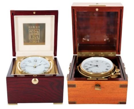 A Concord Marine Chronometer in brass bound mahogoney case. and a cased chronometer with plaque. Size right: 6 1/2 x 6 x 5 1/