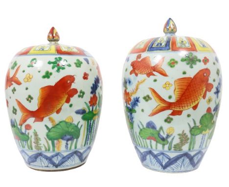 Pair Chinese Covered Ceramic Urns. These pieces have very colorful design with large goldfish depictions. Size: 9 x 9 x 13 in