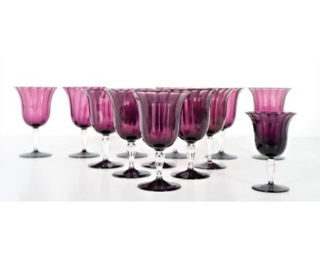 Set of Carder Steuben Amethyst ribbed optic clear stemmed Wine Goblets. Size: 3 1/2 x 3 1/2 x 6. 1 is smaller. Provenance: Es