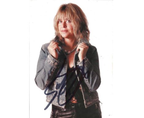 Susie Quatro signed 7 x 5 colour portrait photo. Good Condition. All signed pieces come with a Certificate of Authenticity. W