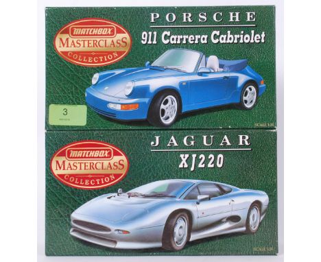 MATCHBOX: 2x Matchbox Masterclass Collection boxed 1:24 scale diecast model cards - Porsche and Jaguar. Both within the origi