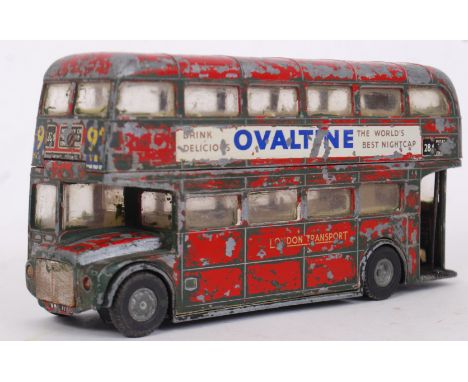 SPOT ON: An original Spot On 1:42 scale diecast model London Routemaster bus. Heavily playworn, but retains the Ovaltine sign