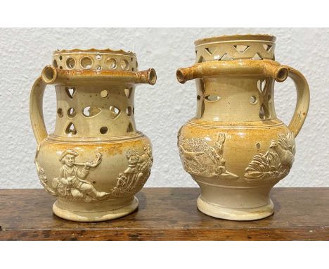 Two salt-glazed puzzle jugs by Brampton Pottery, Chesterfield18th or 19th Century, decorated with various animals amongst fol