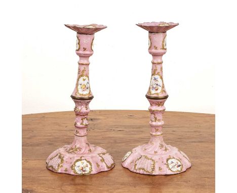 Pair of Bilston pink enamel candlesticksEnglish, circa 1780, painted with flower and bird panels, 25cm high (2)Provenance: Th