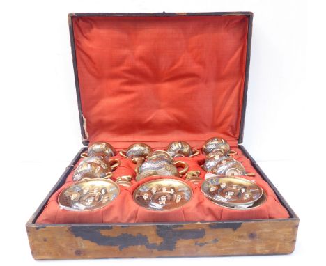 A late 19th/early 20th century natural pine cased six place Japanese satsuma pottery setting; comprising cups, saucers, teapo