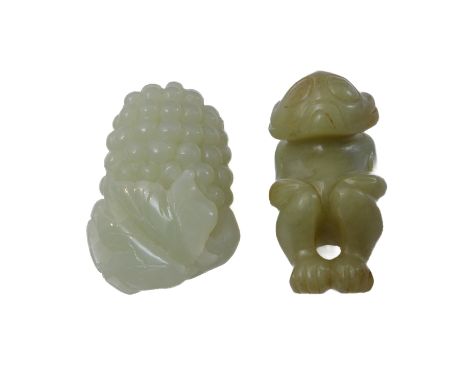 A Chinese pale celadon jade carving of grapes and vine leaves, together with a similar sized carved jade netsuke of a monkey-