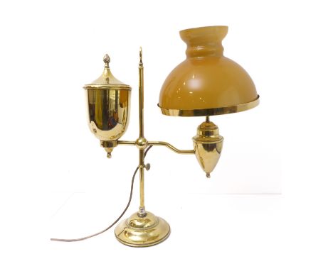 An ornate brass adjustable table lamp, together with a mustard coloured glass shade