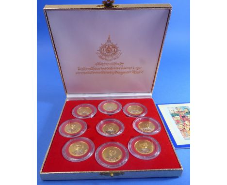 A boxed set of nine proof commemorative medallions (possibly Thai silver-gilt) with accompanying leaflet